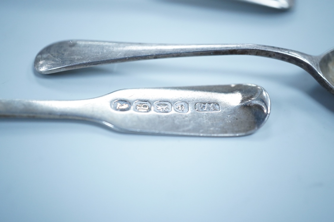 Two William IV silver fiddle pattern condiment spoons, both London 1831, a Victorian silver gilt ear wax spoon(lacking handle), two other silver spoons, a small white metal fork and a silver handled magnifying glass.